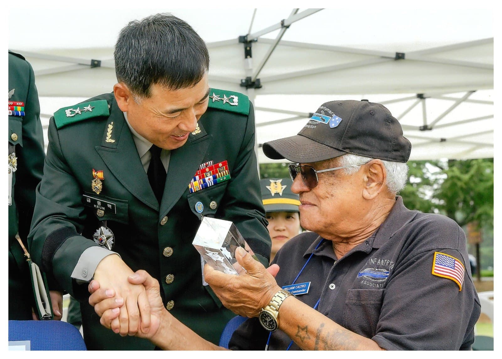 A Republic of Korea general shaking hands with William Castro
